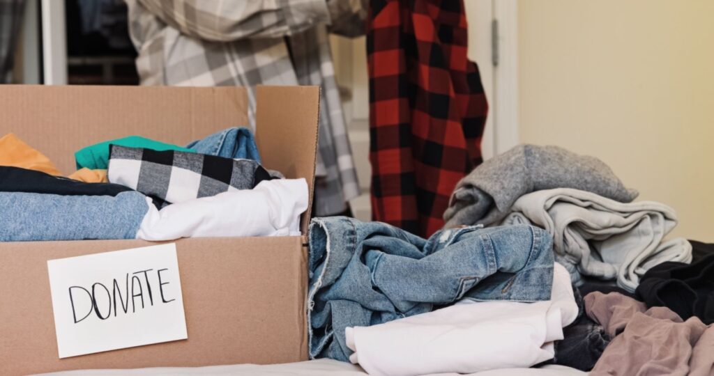 sorting clothing to keep or donate